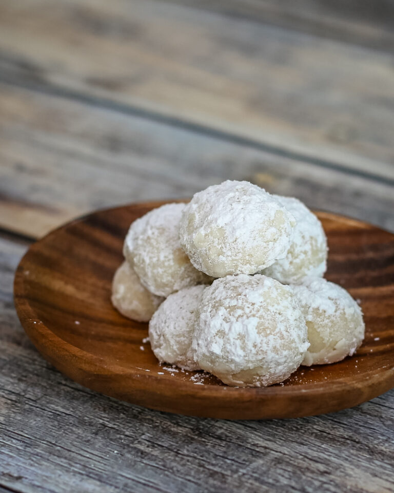 Butter pecan snowball cookies dusted with powdered sugar.