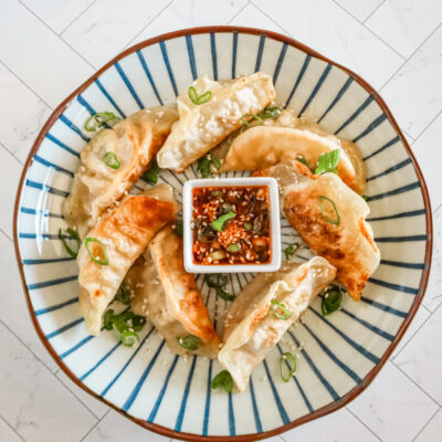 chili crisp dippping sauce with some fried dumplings