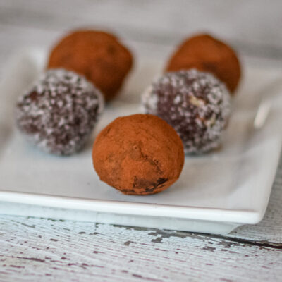 chocolate bourbon truffles on a plate with cocoa or sugar coating