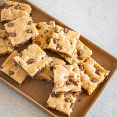 Classic chocolate chip cookie bars arranged on a platter