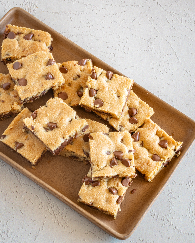 Classic chocolate chip cookie bars arranged on a platter