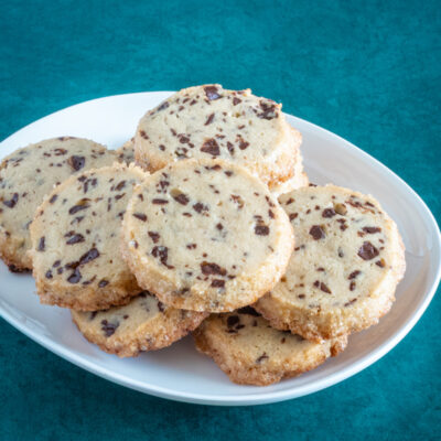 A plate of chocolate chip sablé cookies.
