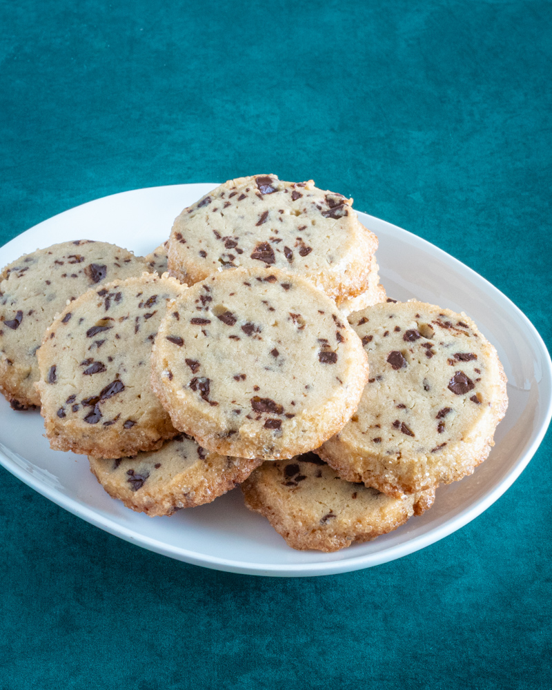 A plate of chocolate chip sablé cookies.