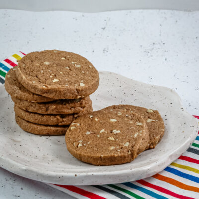 chocolate icebox cookies stacked on a plate