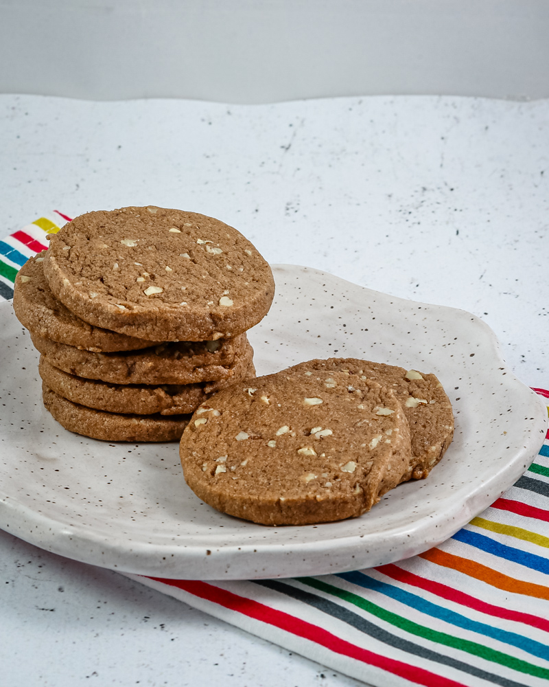 chocolate icebox cookies stacked on a plate