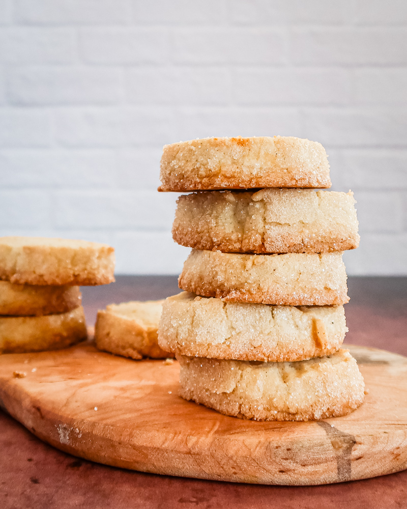 A stack of citrus cardamom sable shortbread cookies.
