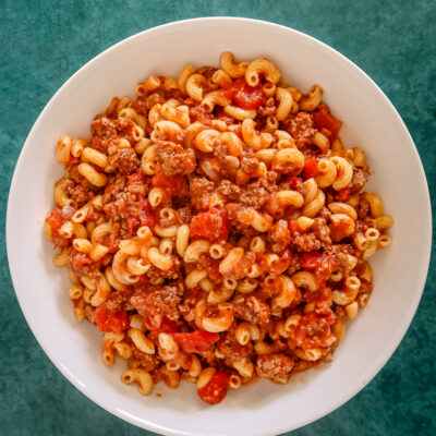 American chop suey in a large bowl, overhead shot.