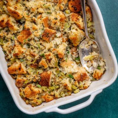 bread stuffing or dressing in a baking with serving spoon
