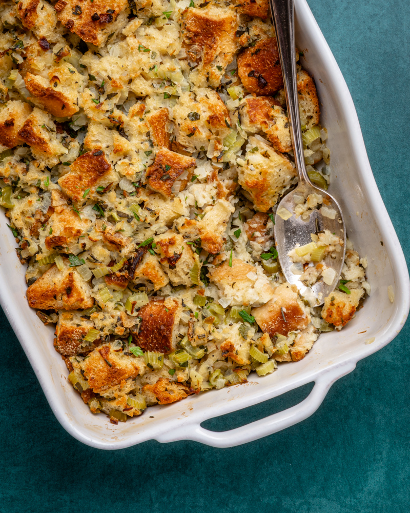 bread stuffing or dressing in a baking with serving spoon
