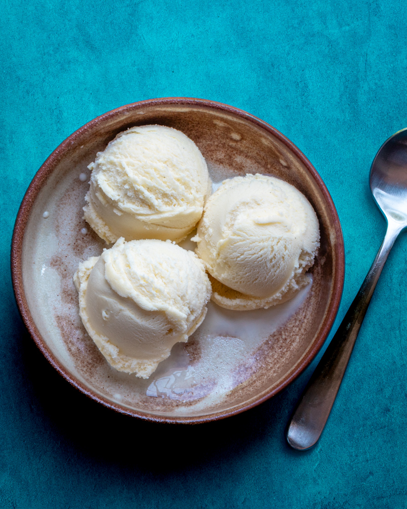 3 scoops of gelato in a bowl with a spoon