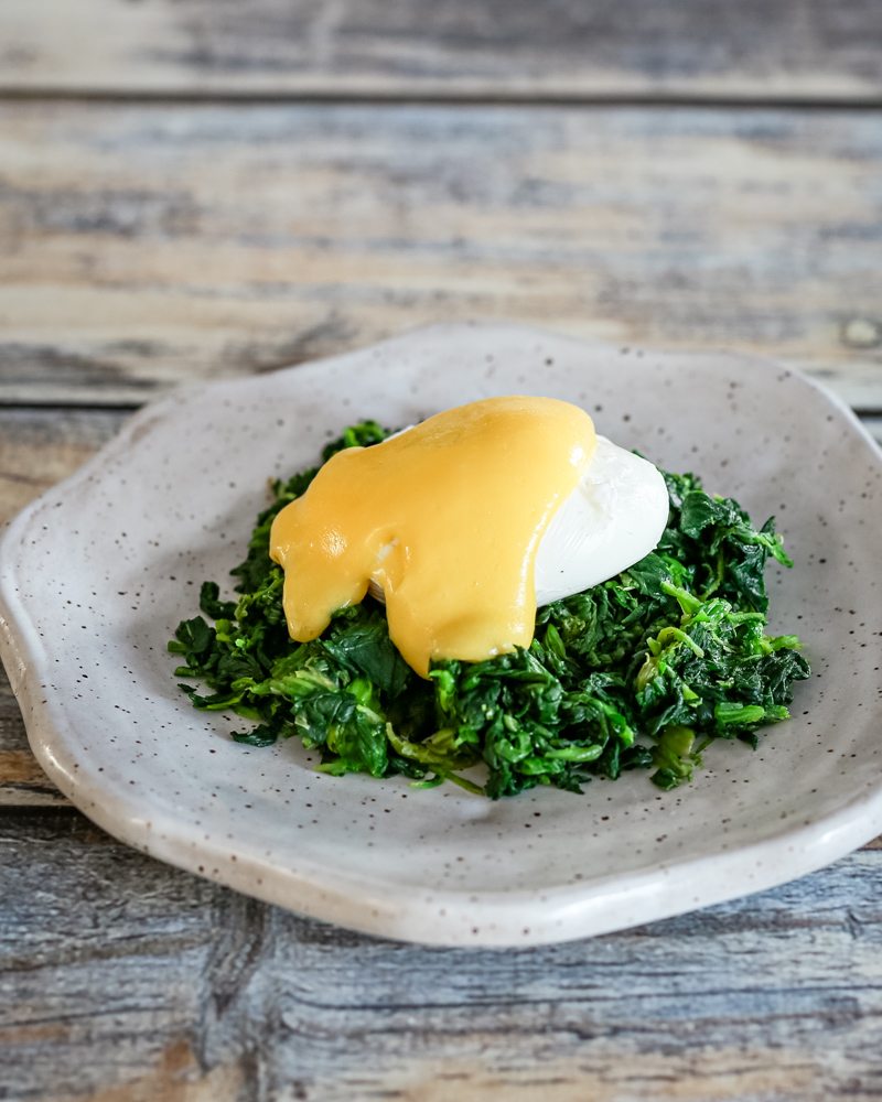 classic hollandaise sauce on a poached egg