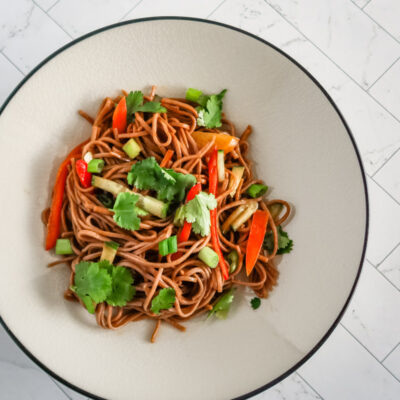 A serving of soba noodle salad with Asian flavors