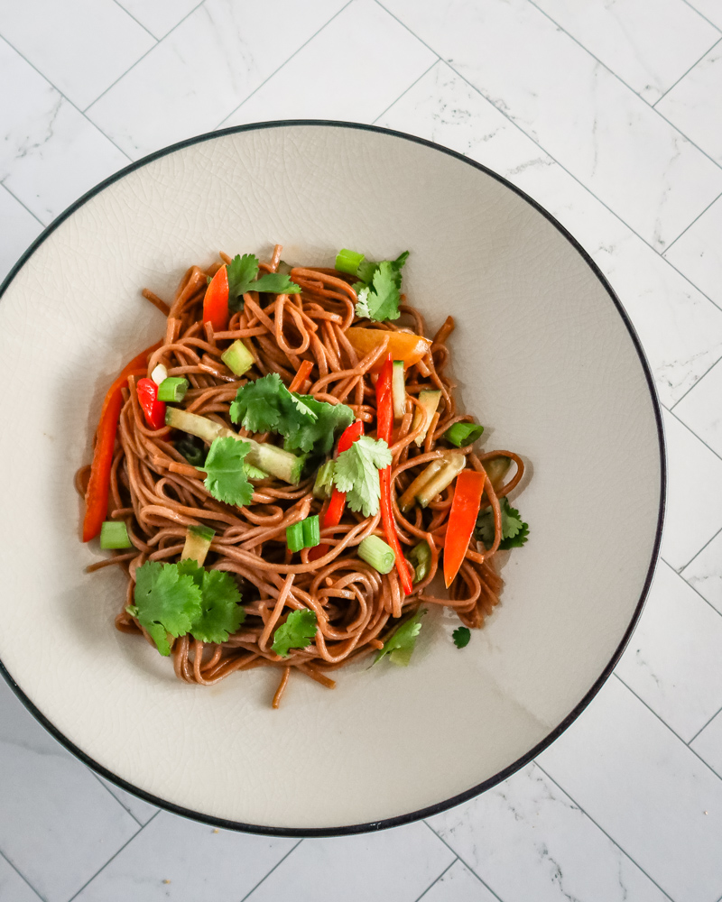 A serving of soba noodle salad with Asian flavors