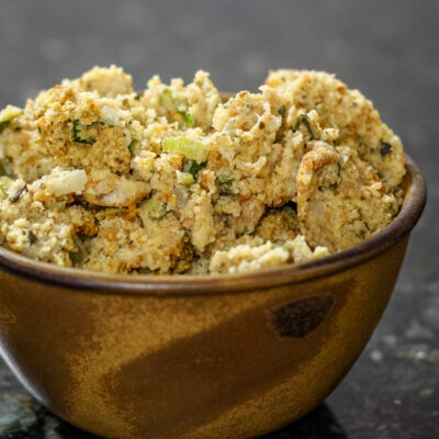 A serving bowl with cornbread and sausage dressing.