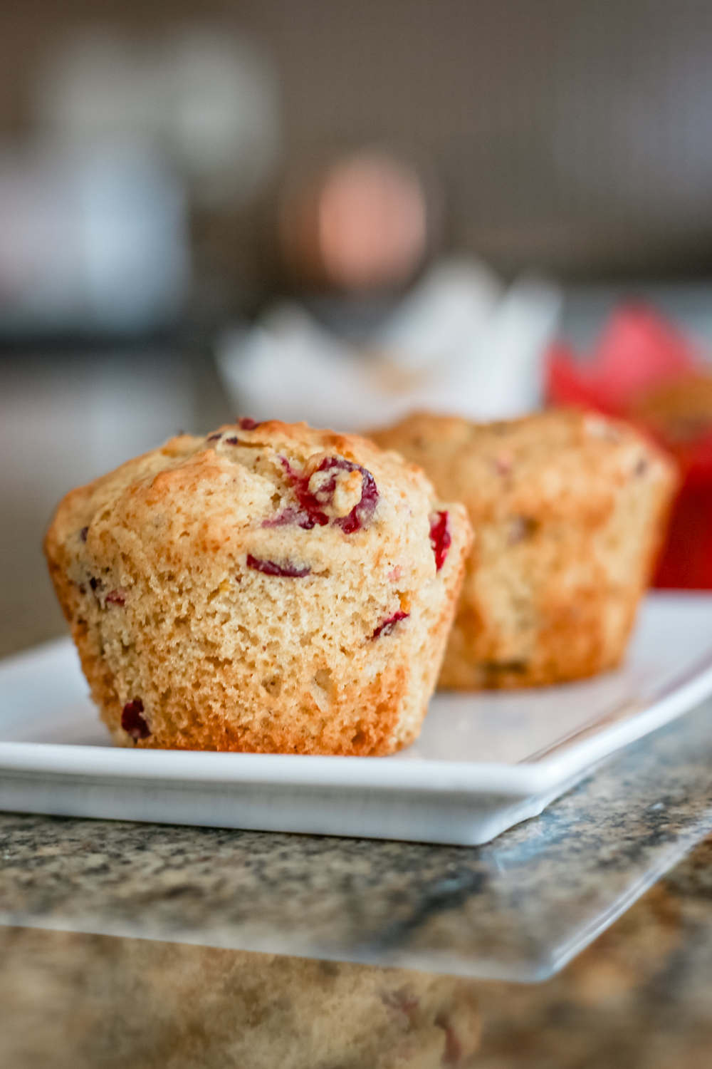 A plate of cranberry orange muffins.