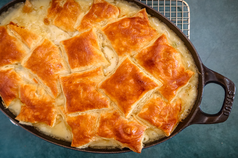 Chicken pot pie with golden brown patch topping.