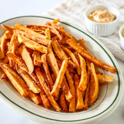 Sweet potato fries on a serving plate.