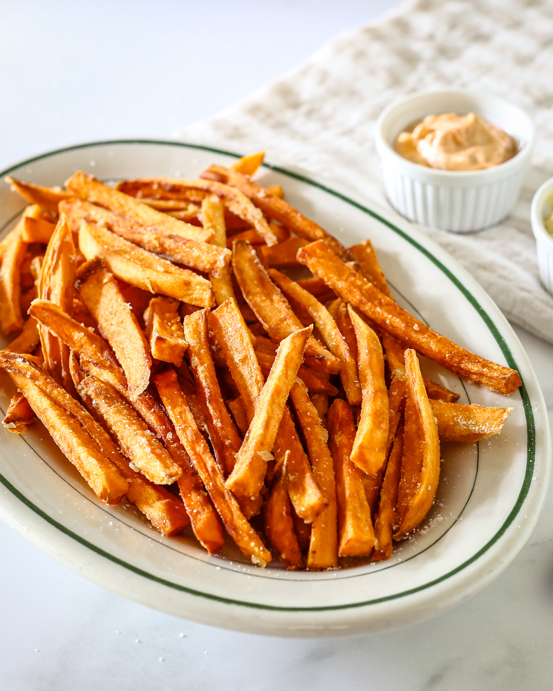 Sweet potato fries on a serving plate.