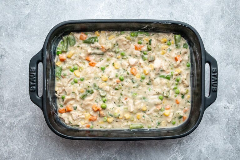 Chicken filling mixture is in the baking dish.
