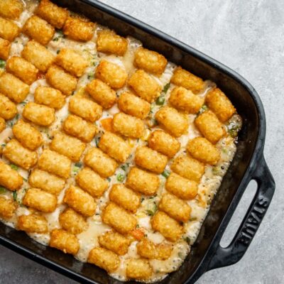 A chicken casserole topped with tater tots.
