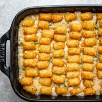A chicken casserole topped with tater tots.