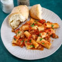 Rigatoni with a bright sausage ragu that's packed with flavor, plus some crusty bread on the side.