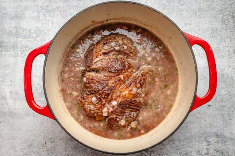 Simmering the Yankee pot roast in a Dutch oven.