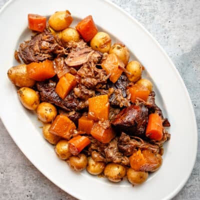 A platter of Yankee pot roast with a variety of veggies.