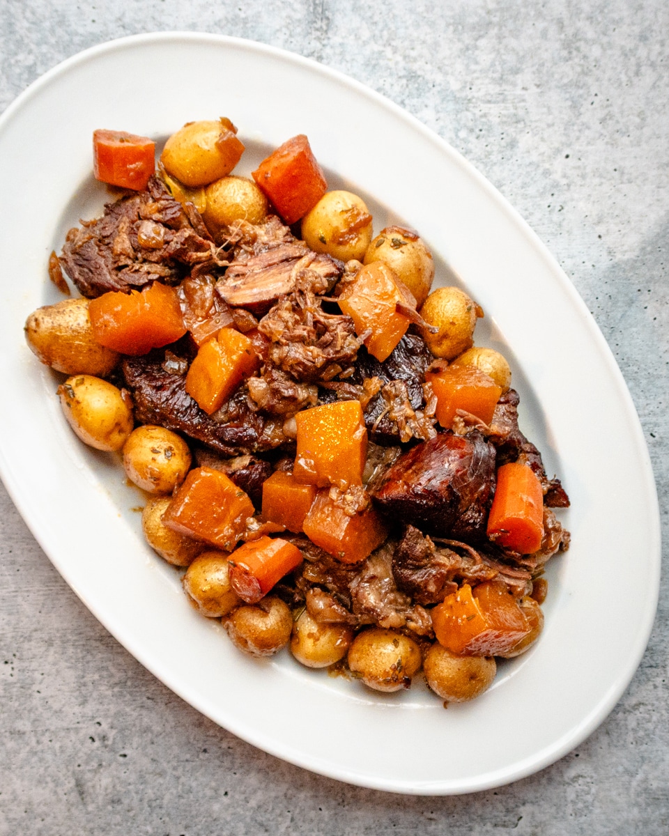 A platter of Yankee pot roast with a variety of veggies.