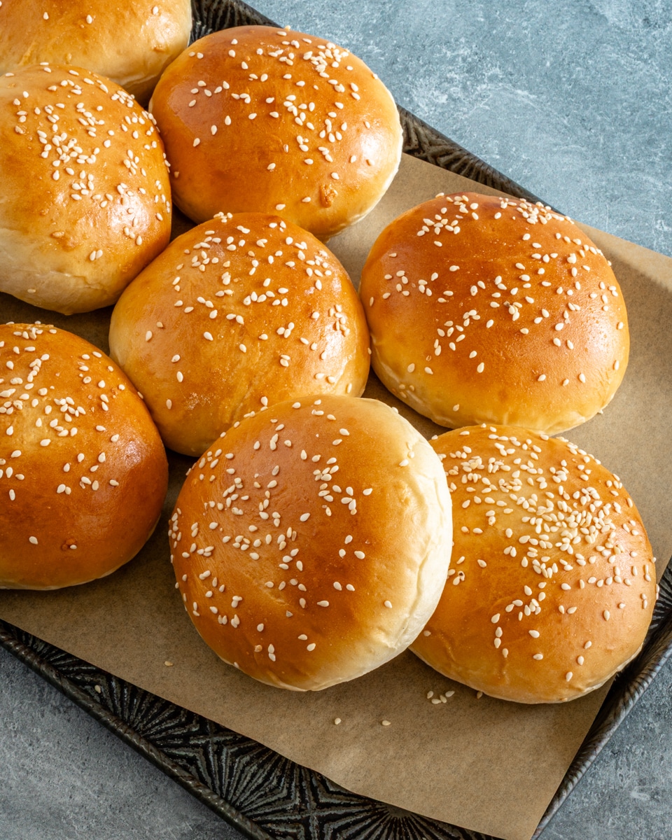 Homemade potato hamburger buns with sesame seed topping.