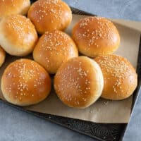 Homemade potato hamburger buns with sesame seed topping.