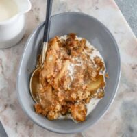 Creamy baked apple dessert with crispy topping.