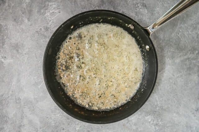 Making the garlic and butter sauce for air fryer garlic Parmesan chicken wings.