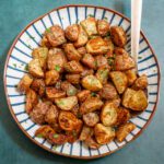 golden brown air fryer potatoes in a serving dish