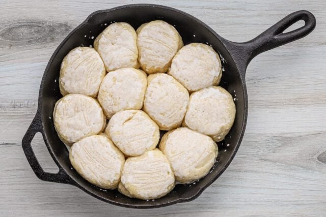 Soft dough balls in a cast iron skillet.