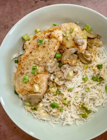 apple brandy chicken on a bed of rice with mushrooms and green onions