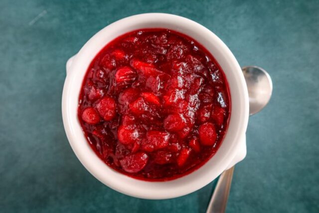 A small serving bowl of apple cider cranberry sauce.