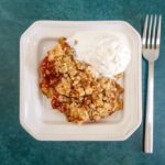 dessert plate with apple crisp and ice cream