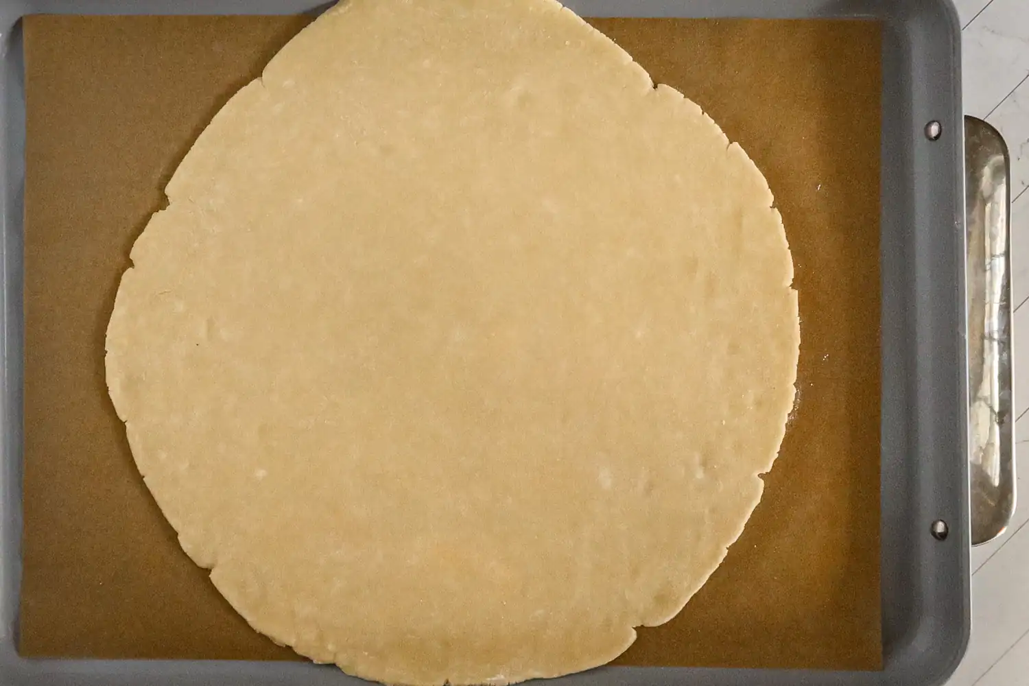 Preparing the pastry for the apple galette.
