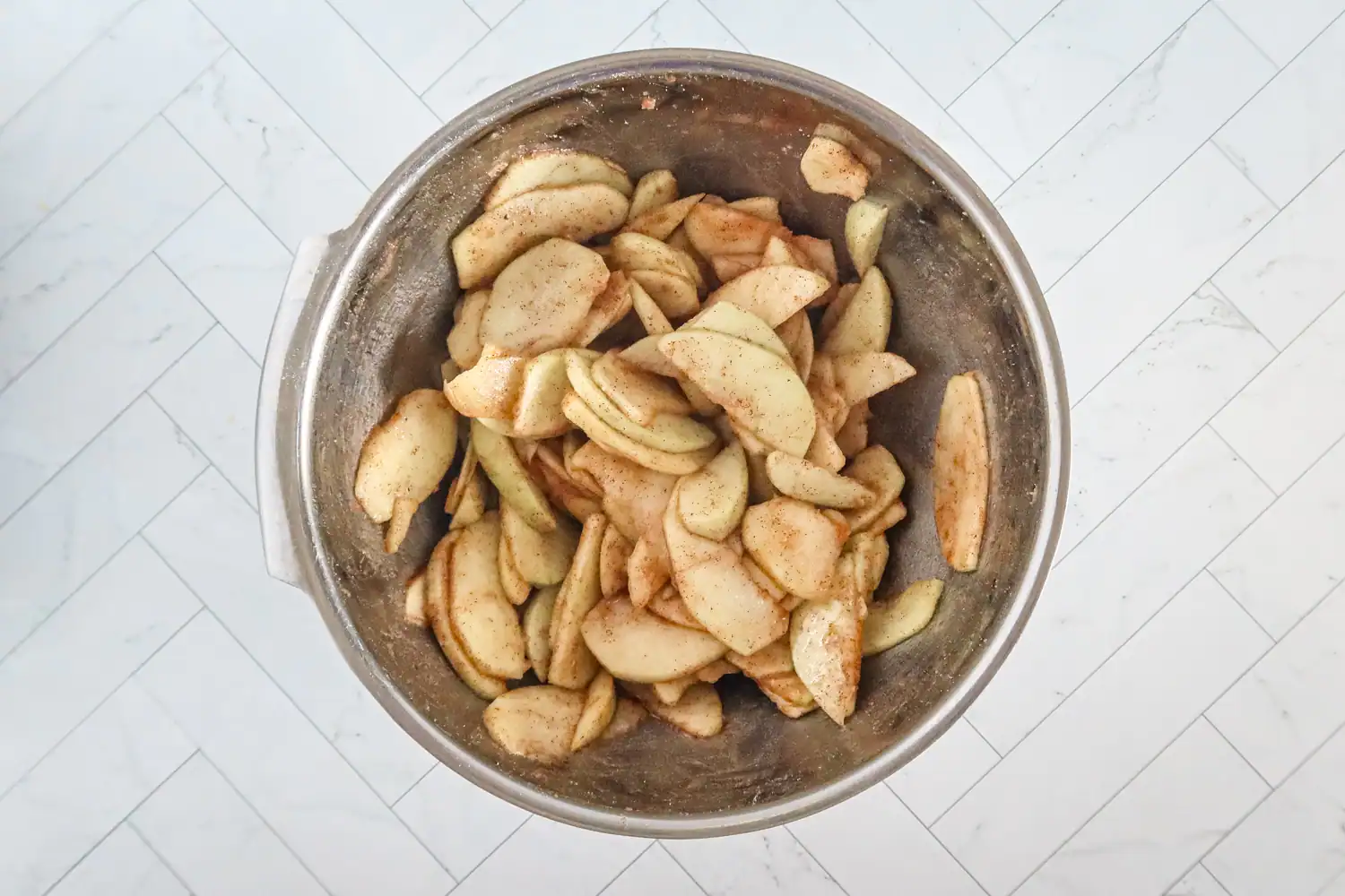 Preparing the apple filling for the galette.