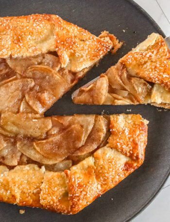 an apple galette with a slice cut out of it