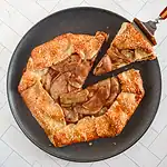 Rustic apple galette with golden crust and caramelized fruit.