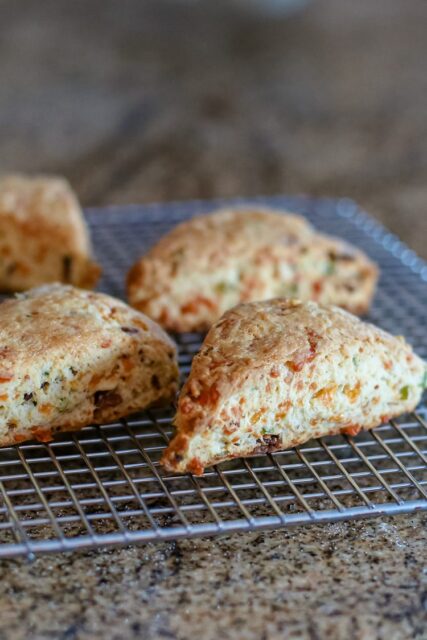 baked bacon and cheddar scones on a cooling rack