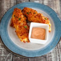 crispy baked chicken strips with panko, cheddar, and bacon coating.