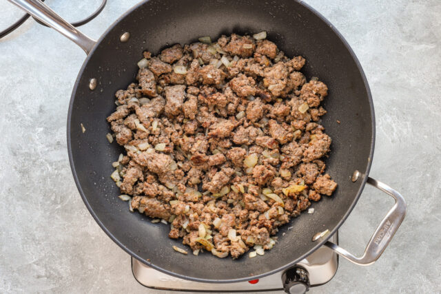 Cooking the ground beef and onions for a big meal of baked ziti.