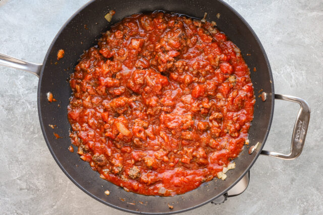 Completing the sauce for baked ziti.