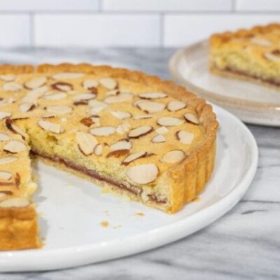 bakewell tart with a slice in the background