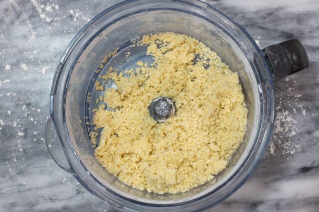 Bakewell tart prep: food processor with ingredients for the sweet crust.