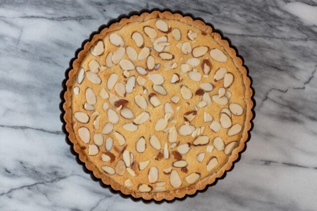 An overhead shot of a classic Bakewell tart.