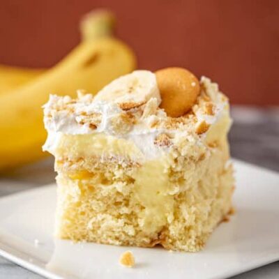 a slice of banana poke cake